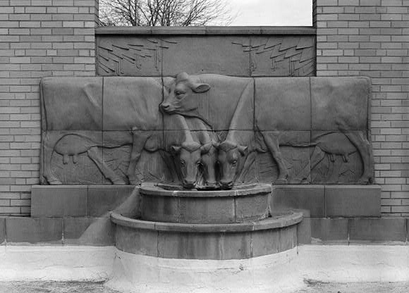 Sculpture of dairy cows drinking water at Christian Petersen Courtyard & Dairy Industry Building at ISU Campus