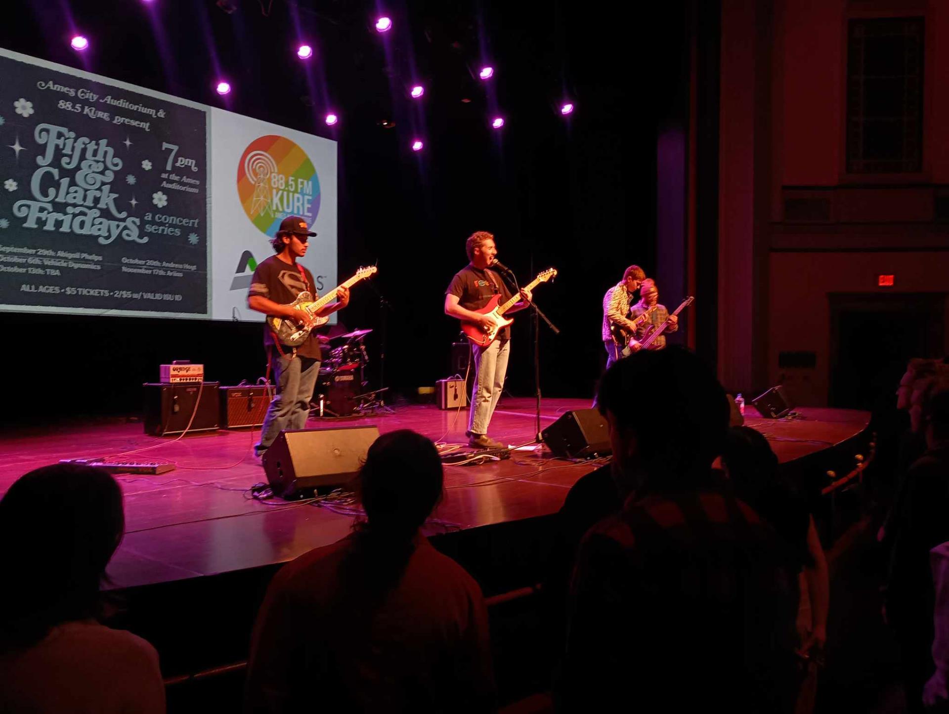 Band performing on stage at City Auditorium