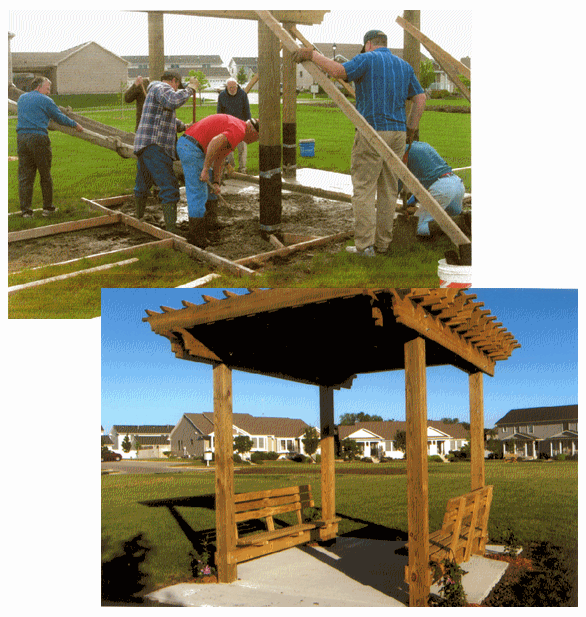 People constructing a pergola