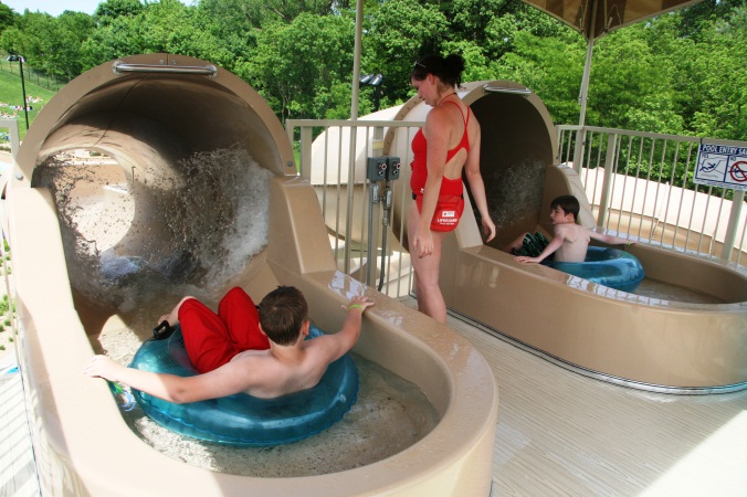 Swimmers at the top of the enclosed water slide.