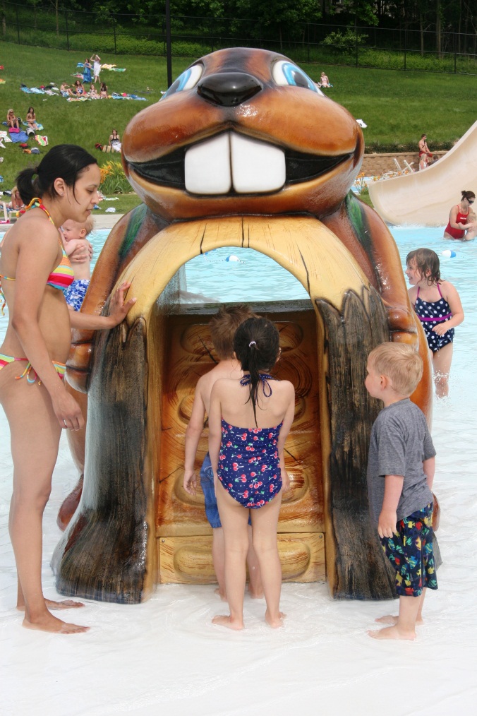 Children playing at a play structure at the Furman Aquatic Center