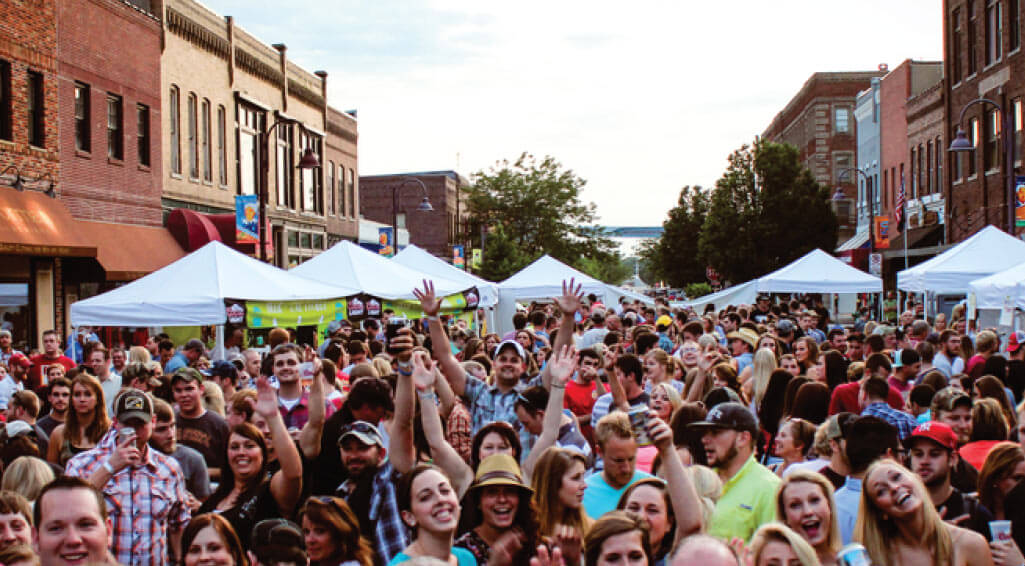 A crowd of people filling Main Street. 